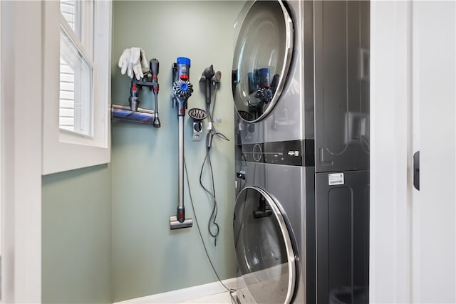 laundry area featuring stacked washer and clothes dryer