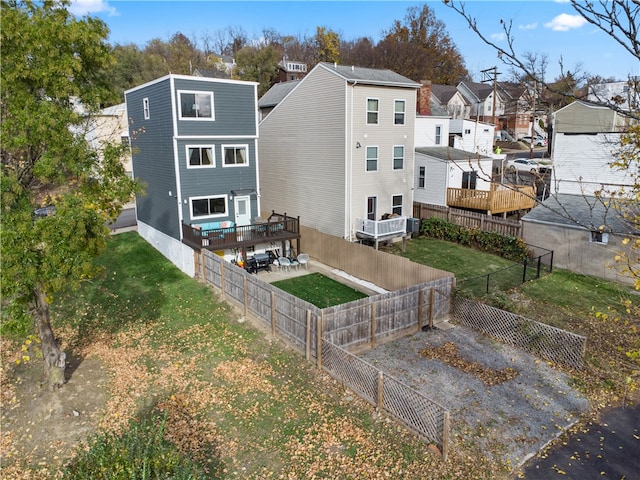 rear view of house with a yard and central air condition unit