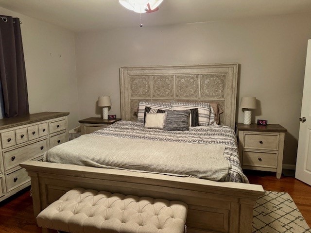 bedroom featuring dark wood-type flooring