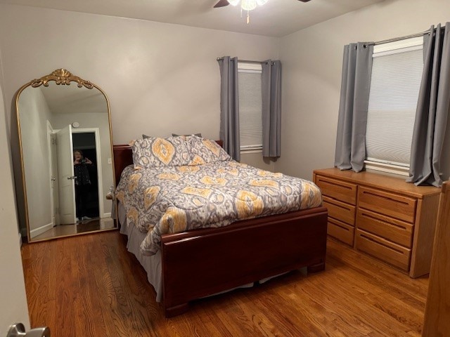 bedroom featuring hardwood / wood-style floors and ceiling fan