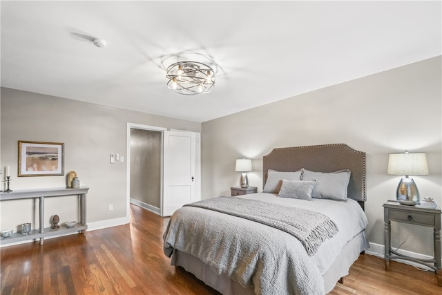 bedroom with hardwood / wood-style floors