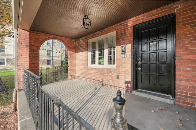 view of exterior entry featuring a porch