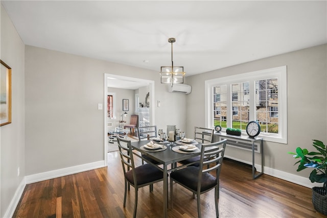 dining room with dark hardwood / wood-style flooring, a wall mounted air conditioner, and a notable chandelier