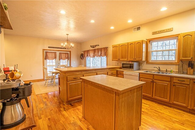 505 Greenbriar Rd, Pa, PA 15431 - kitchen featuring a sink, stainless steel microwave, white dishwasher, a kitchen island, and a chandelier