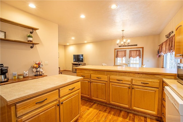 505 Greenbriar Rd, Pa, PA 15431 - kitchen featuring dishwasher, light countertops, a peninsula, a chandelier, and wood finished floors