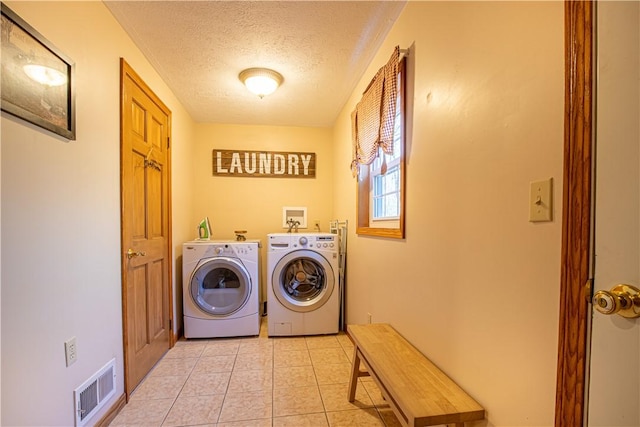 505 Greenbriar Rd, Pa, PA 15431 - laundry area featuring separate washer and dryer, a textured ceiling, and light tile patterned floors