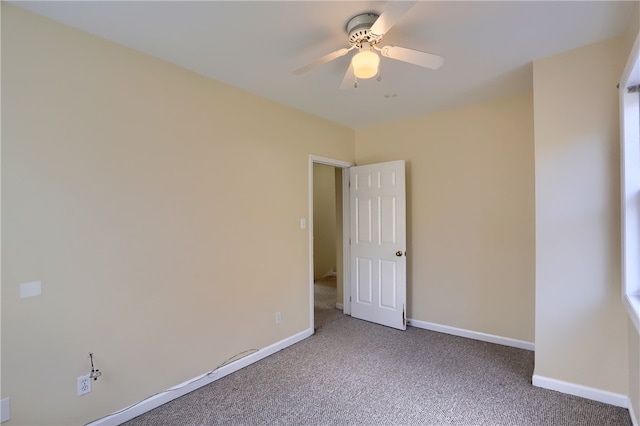 carpeted empty room with ceiling fan