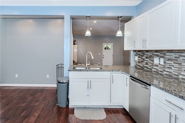 kitchen with stainless steel dishwasher, decorative light fixtures, white cabinets, and sink