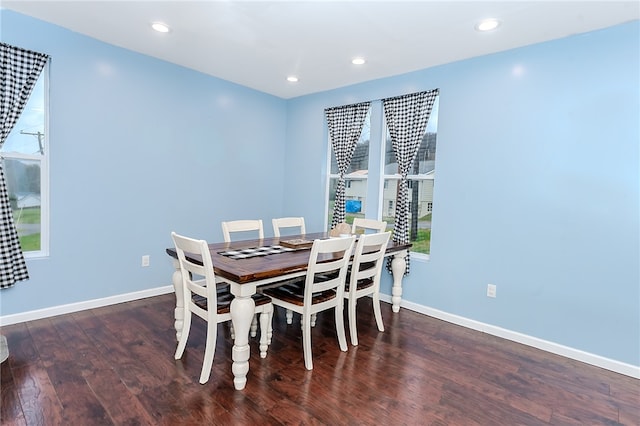 dining room with dark wood-type flooring