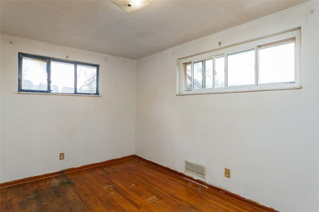 unfurnished room featuring dark hardwood / wood-style floors