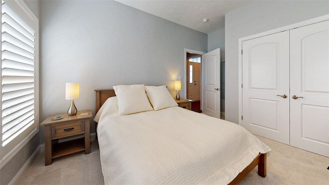 carpeted bedroom featuring a closet