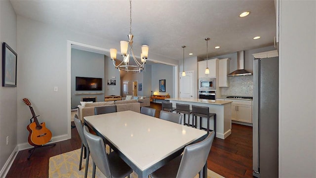 dining room featuring dark hardwood / wood-style flooring and a chandelier