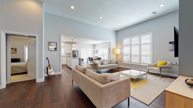 living room with dark hardwood / wood-style flooring