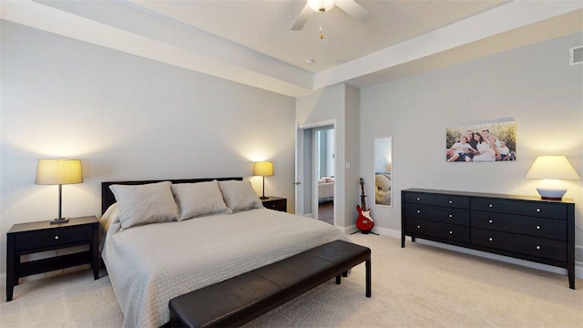 carpeted bedroom with ceiling fan and ensuite bathroom