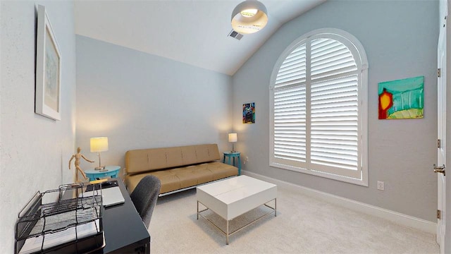 carpeted living room with lofted ceiling