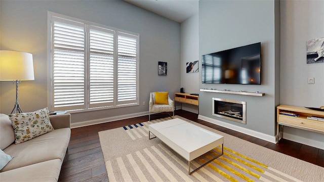 living room with dark hardwood / wood-style flooring