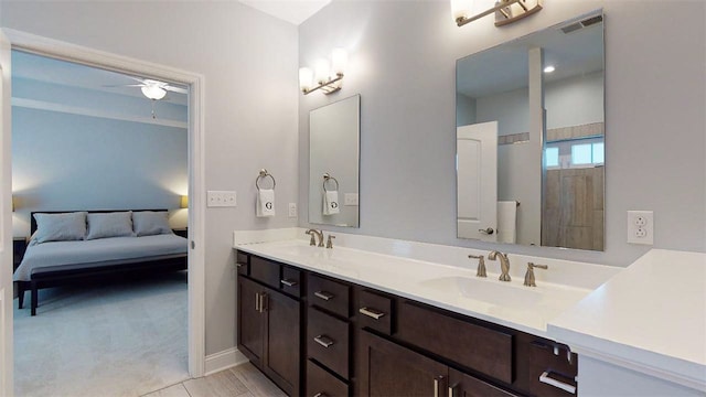 bathroom featuring ceiling fan and vanity