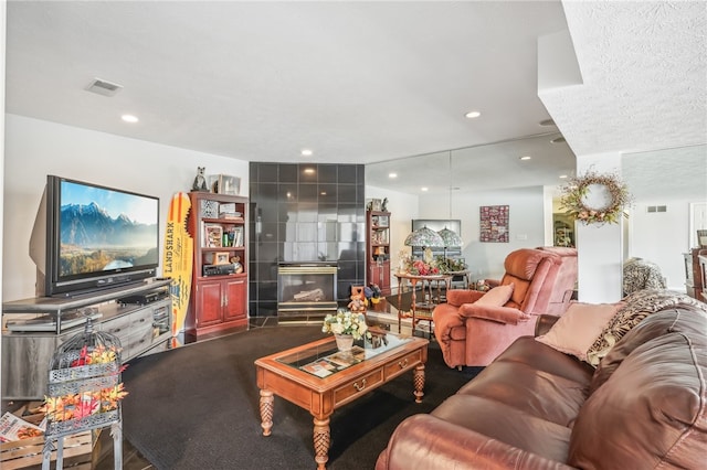 living room with a textured ceiling