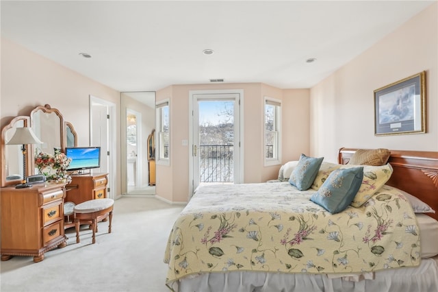 carpeted bedroom featuring access to outside