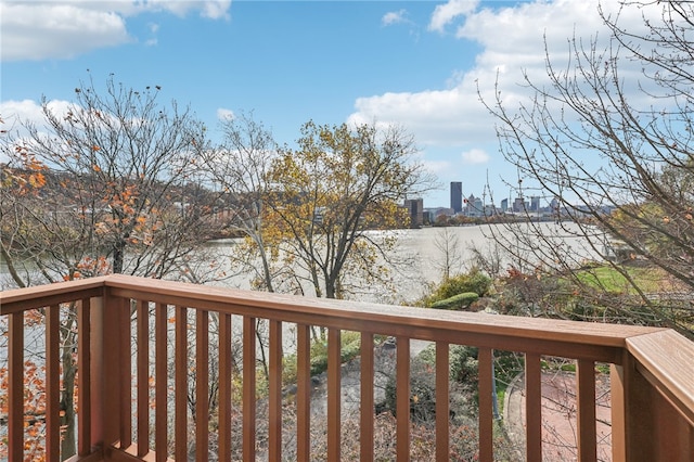 wooden terrace with a water view