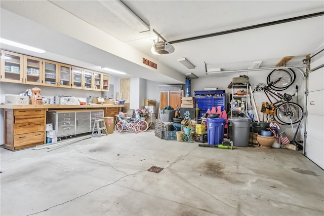 garage featuring a workshop area and a garage door opener