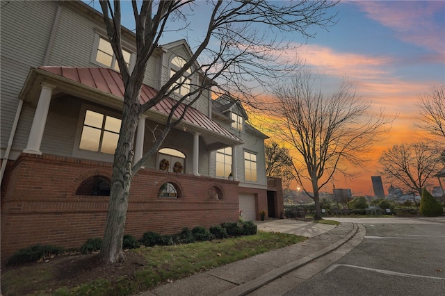 outdoor building at dusk with a garage