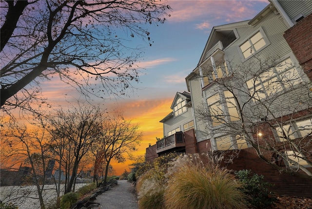 view of outdoor building at dusk