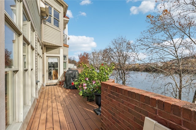 wooden deck with a water view