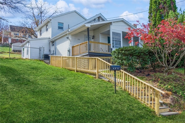 back of house featuring a lawn