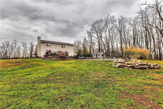 view of yard with a wooden deck