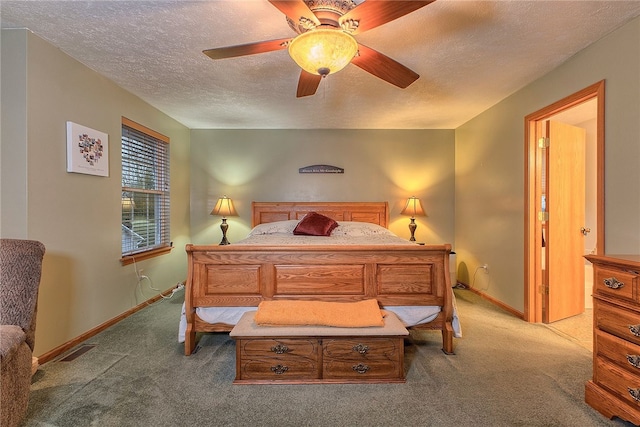 bedroom with carpet, ceiling fan, and a textured ceiling