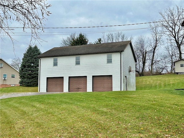 garage featuring a yard