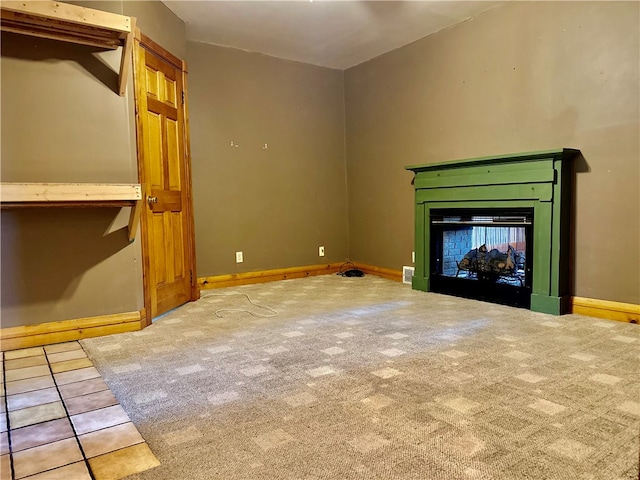 unfurnished living room with carpet