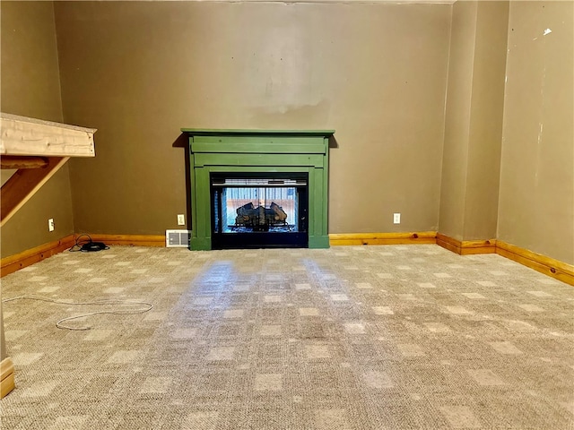 unfurnished living room featuring carpet floors