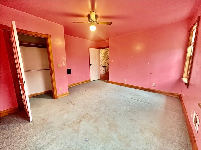 unfurnished bedroom with carpet and ceiling fan