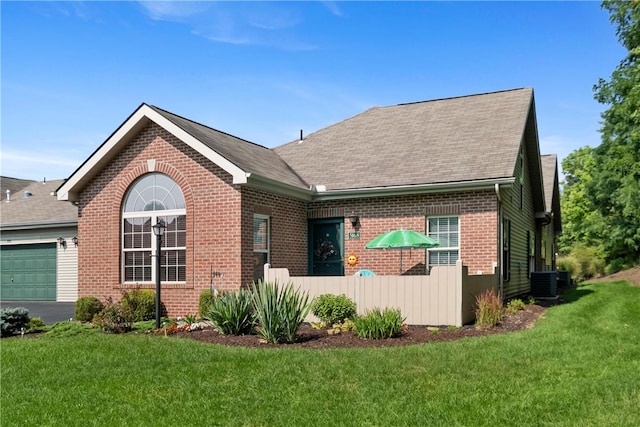 view of front facade featuring a garage and a front lawn