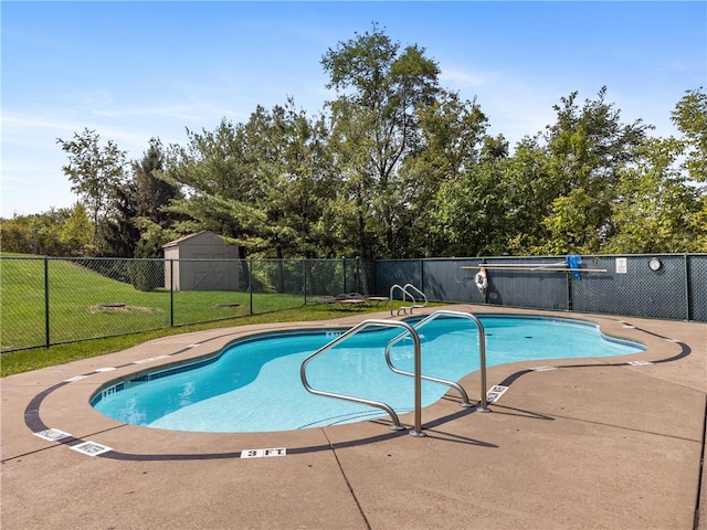 view of swimming pool with a patio area