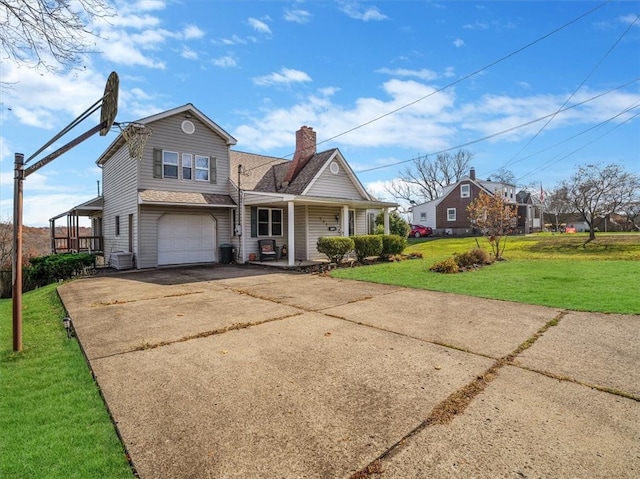 view of front of house with a porch, a garage, and a front lawn