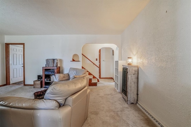 carpeted living room with a baseboard radiator