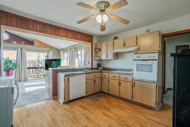 kitchen featuring light wood-type flooring, white appliances, ceiling fan, sink, and lofted ceiling