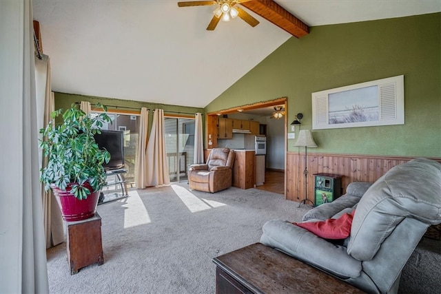 living room with lofted ceiling with beams, light colored carpet, and ceiling fan