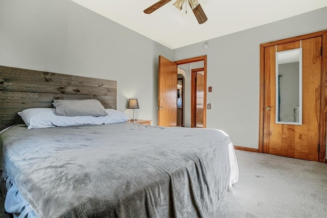 bedroom with ceiling fan, carpet, and vaulted ceiling