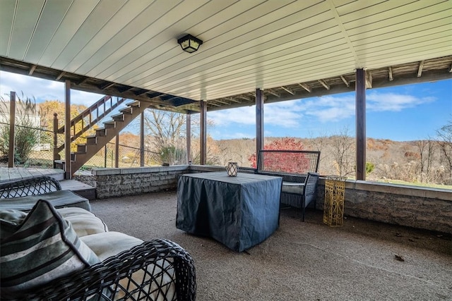 view of patio / terrace featuring a mountain view