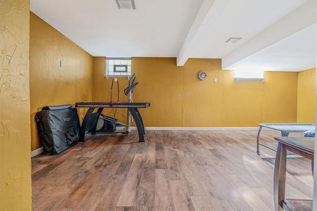 exercise room featuring hardwood / wood-style flooring