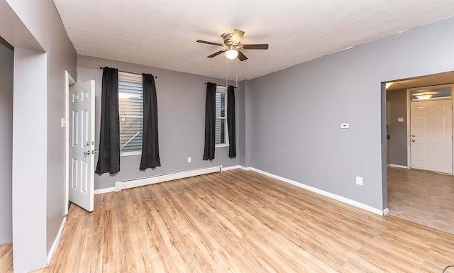 unfurnished room with ceiling fan, light hardwood / wood-style floors, and baseboard heating