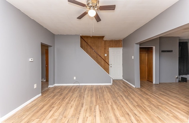 spare room featuring ceiling fan, light hardwood / wood-style flooring, and a baseboard heating unit