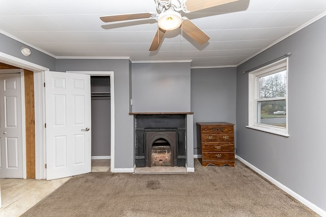 unfurnished living room with carpet flooring, ceiling fan, and crown molding