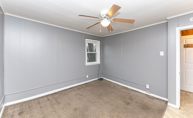 unfurnished room featuring light carpet, ceiling fan, and crown molding