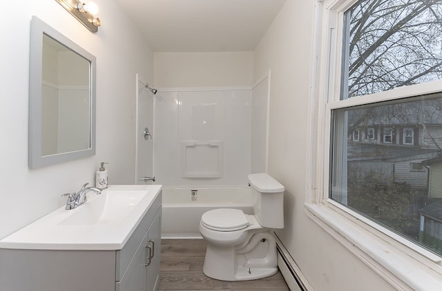 full bathroom featuring vanity, toilet, wood-type flooring, and bathtub / shower combination