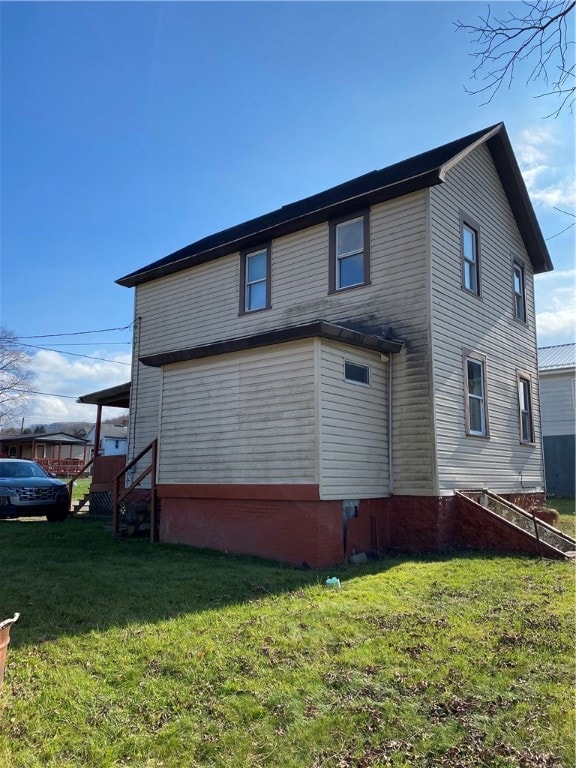 view of property exterior with a lawn